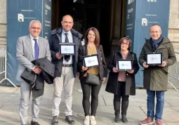 L'assessore comunale alle Attività, Diego Bressi - secondo da sinistra - con Marco Manfrinato, manager del Distretto di Busca e direttore di Confcommercio Cuneo, e con  gli assessori al Commercio di Cuneo, Caraglio e Borgo San Dalmazzo